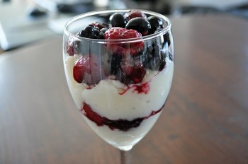 Low fat yogurt mixed with berries, cottage cheese